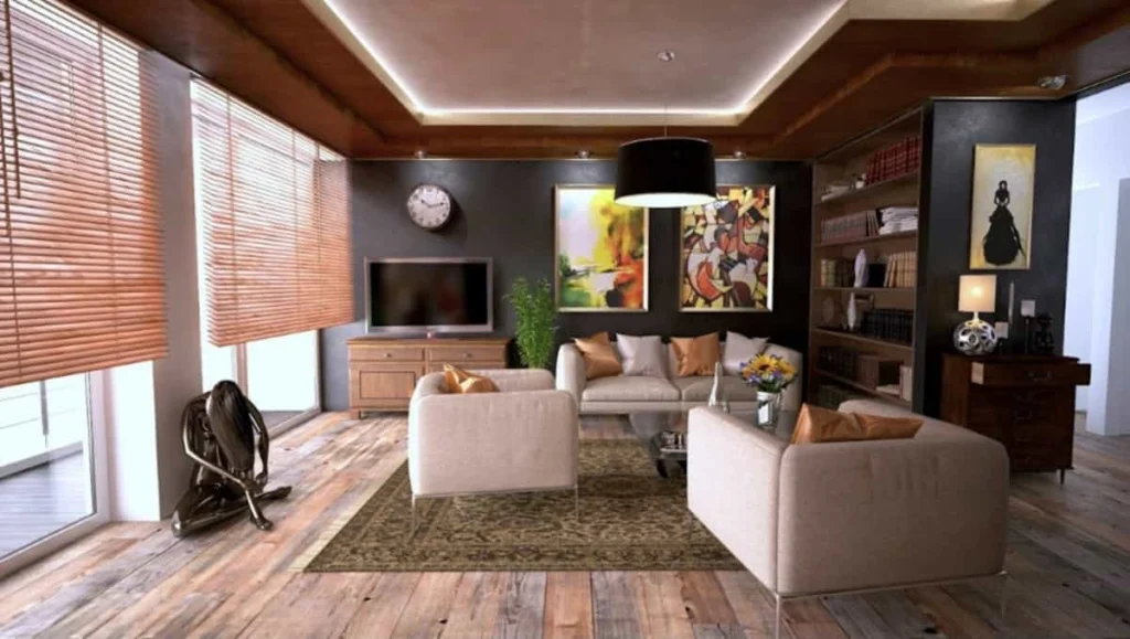 Interno di un soggiorno luminoso con divano e libreria, esempio di immobile destinato ad abitazione principale